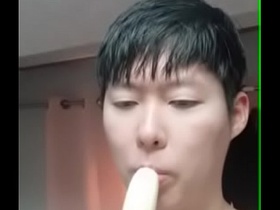 my korean dog sucking on his favorite fruit