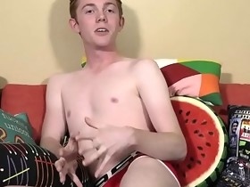 Good looking twink has fun with a dildo after an interview