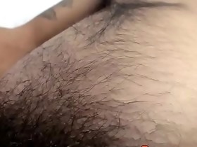 Attractive twink thug strokes his hairy dick and cums solo